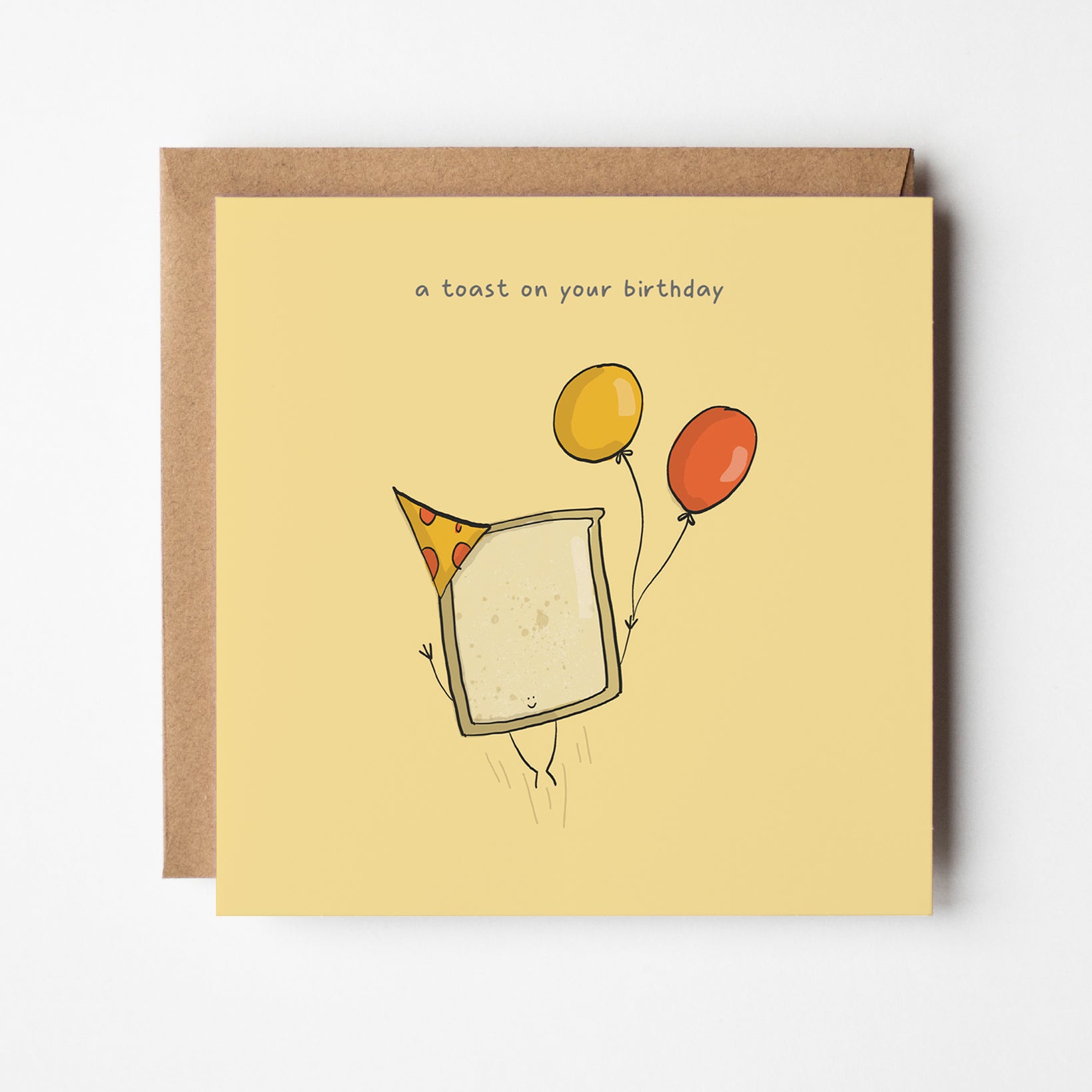 Close-up view of A Toast On Your Birthday card displaying the punny birthday design with kawaii toast illustration