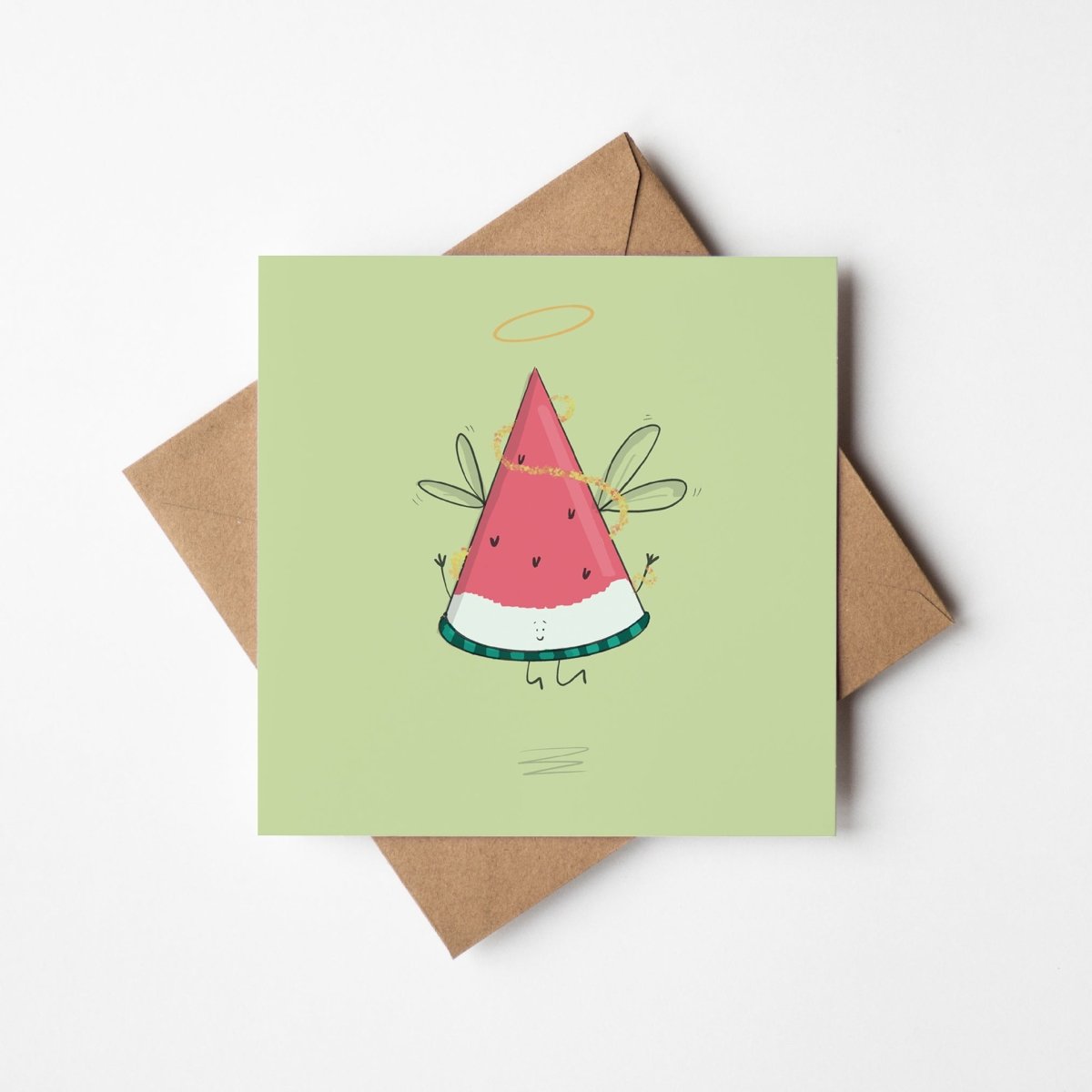 Festive angel watermelon Christmas card mockup showing kawaii design with kraft envelope