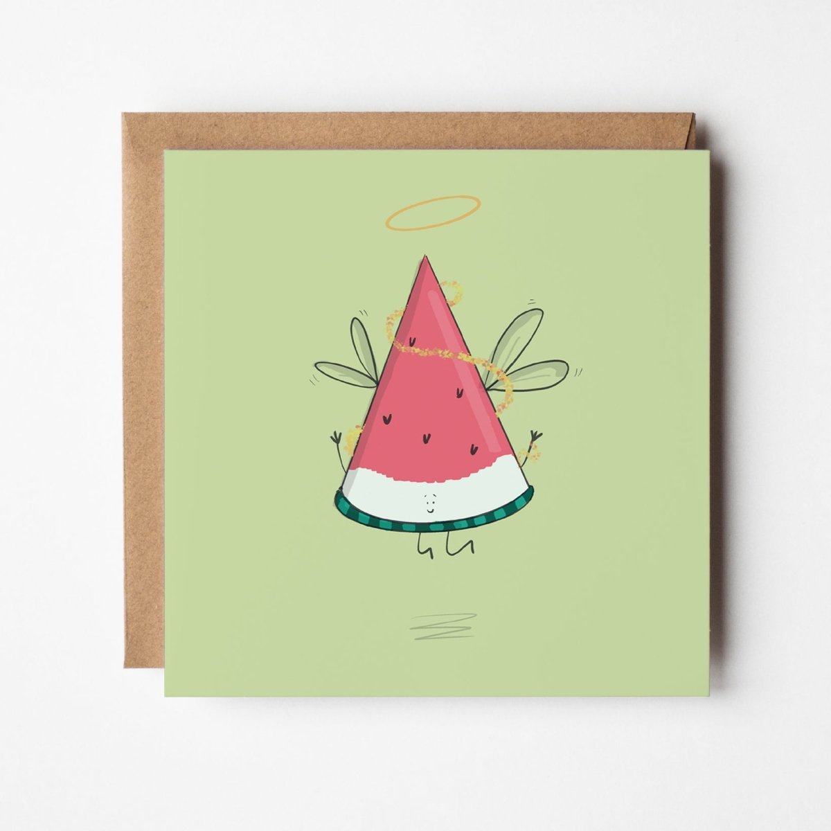 Angel watermelon slice Christmas greeting card featuring cute kawaii fruit with wings and halo