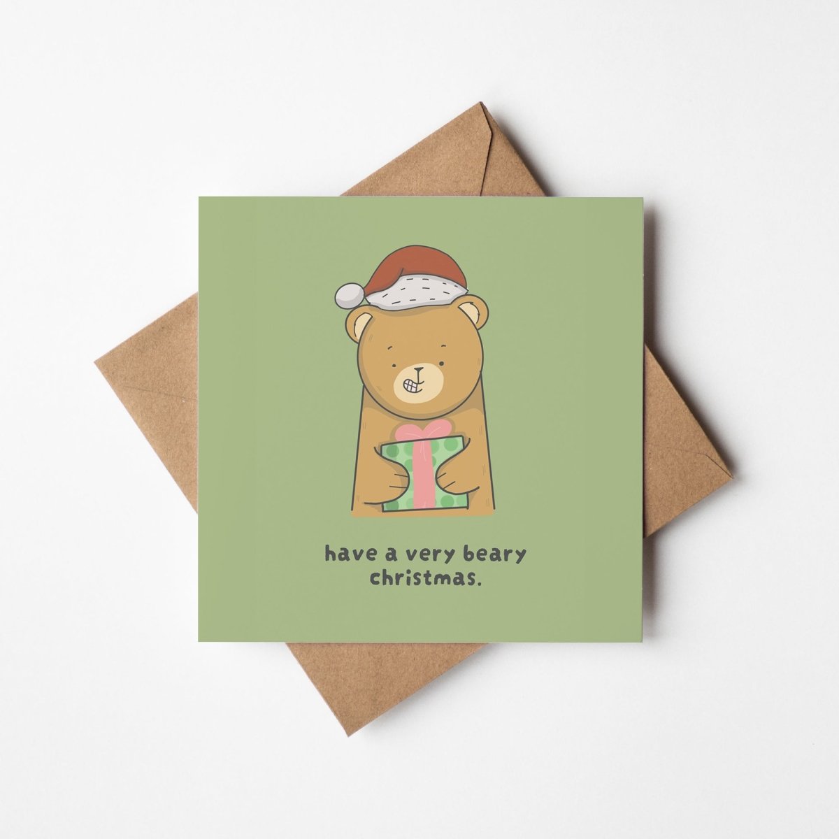 Beary Christmas greeting card featuring cute kawaii bear wearing Santa hat holding wrapped green presen