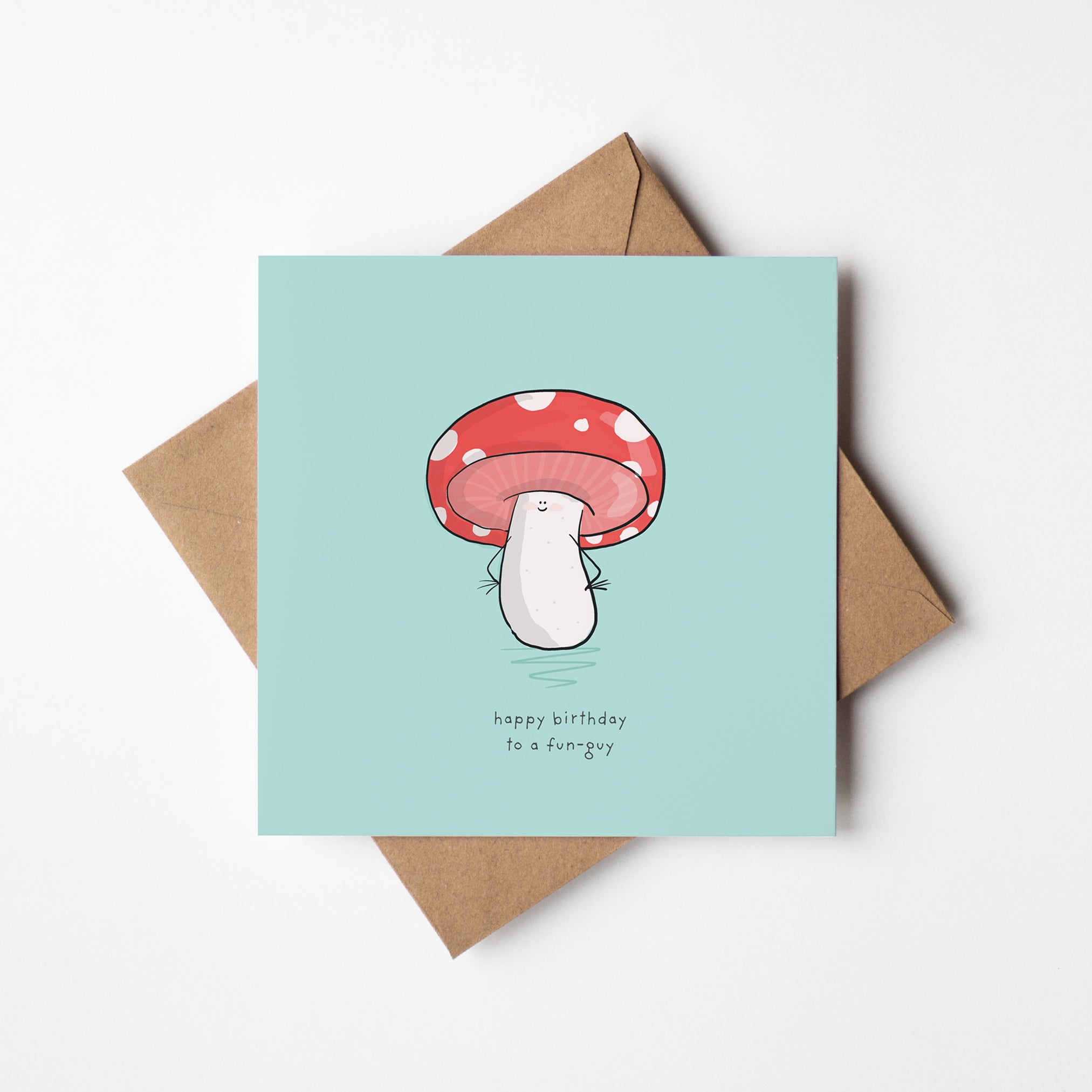 A birthday card with a mushroom illustration and the text "happy birthday to a fun guy" printed on it.