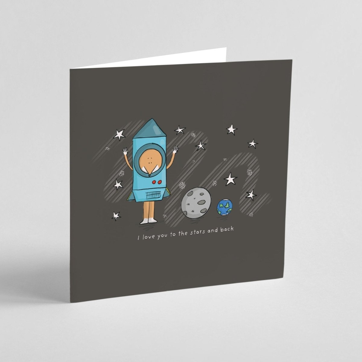 Greeting card with space-themed illustration of a fox in a rocket suit on a gray background