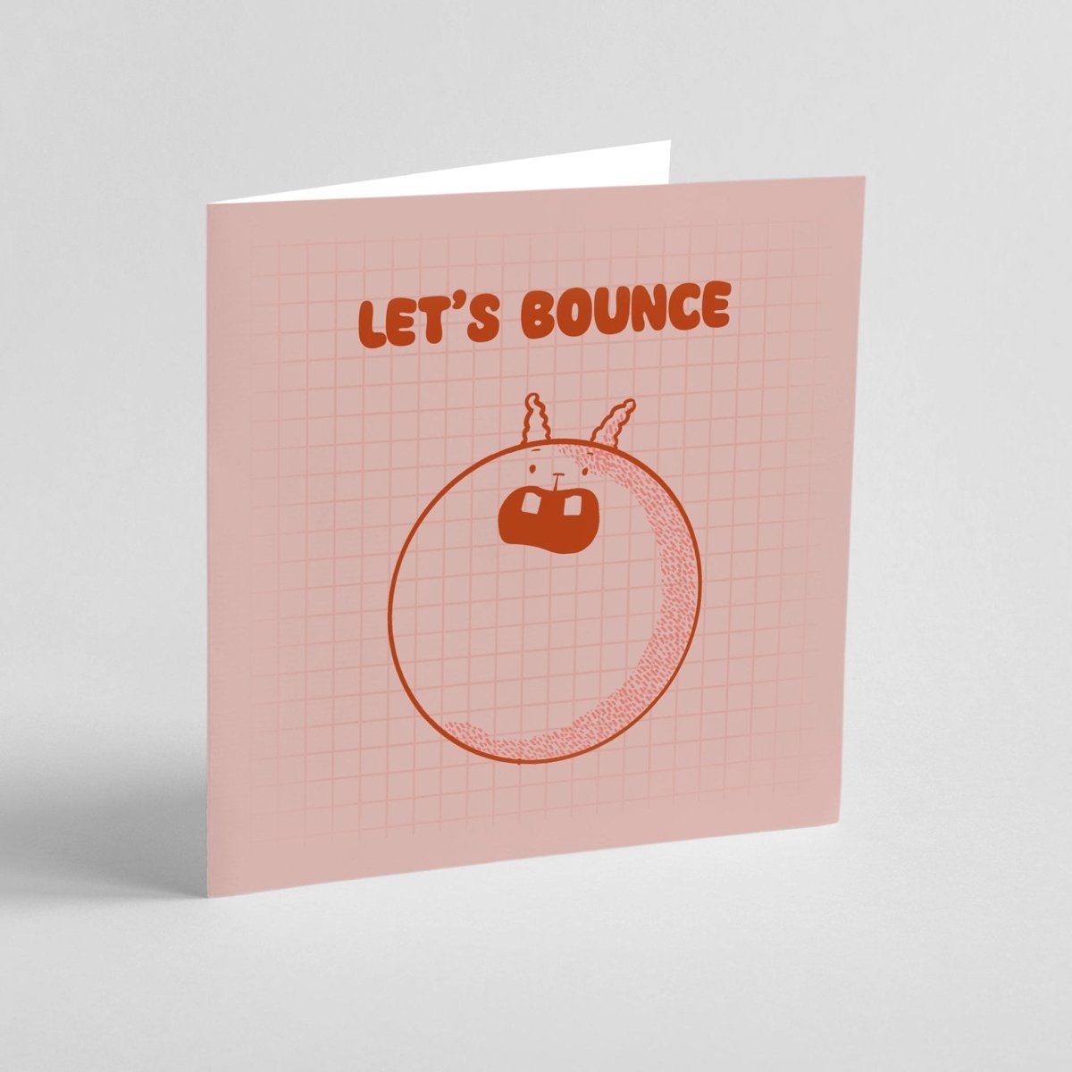 Greeting card with 'Let's Bounce' text and a cartoon character on a pink grid background