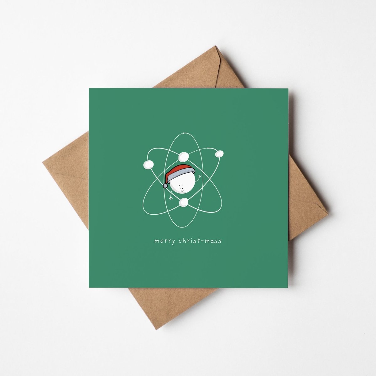 Funny science Christmas card mockup showing atom character with kraft envelope