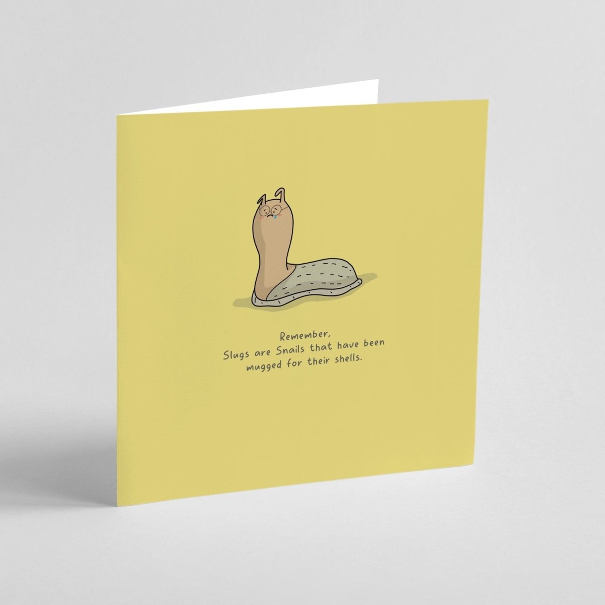 Greeting card with a cartoon slug illustration and humorous text on a yellow background