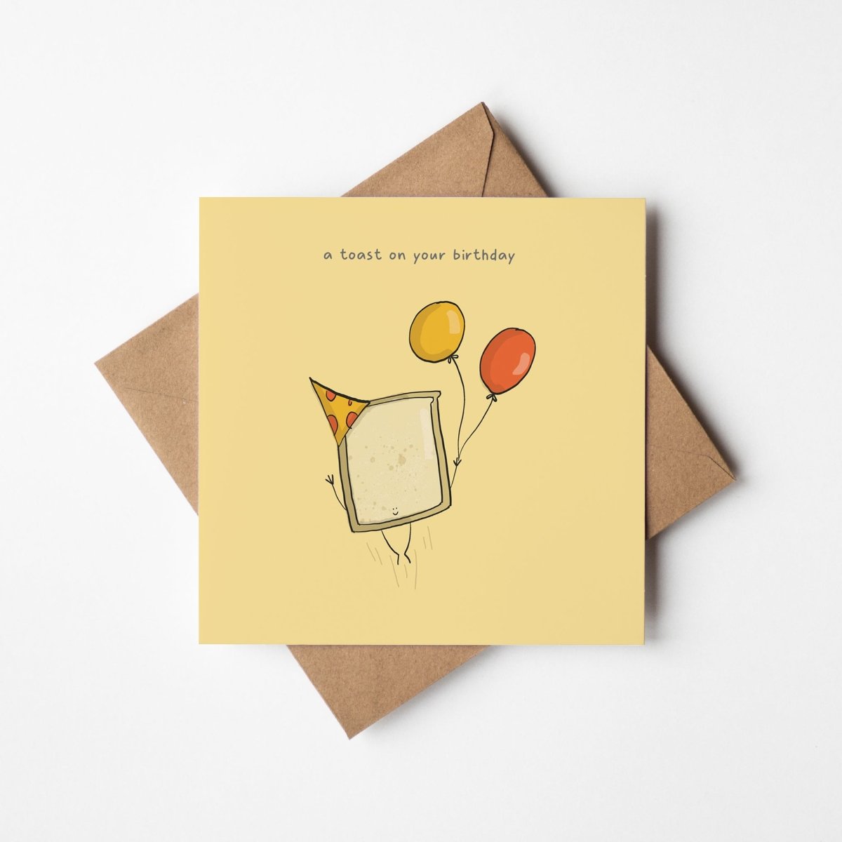  Toast On Your Birthday greeting card showing cute illustrated toast character with birthday message on white card"