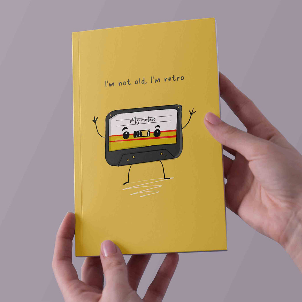 Vintage Cassette Notebook with 'I'm not old, I'm retro' phrase, A5, mustard-yellow cover, ideal for music enthusiasts and note-taking."