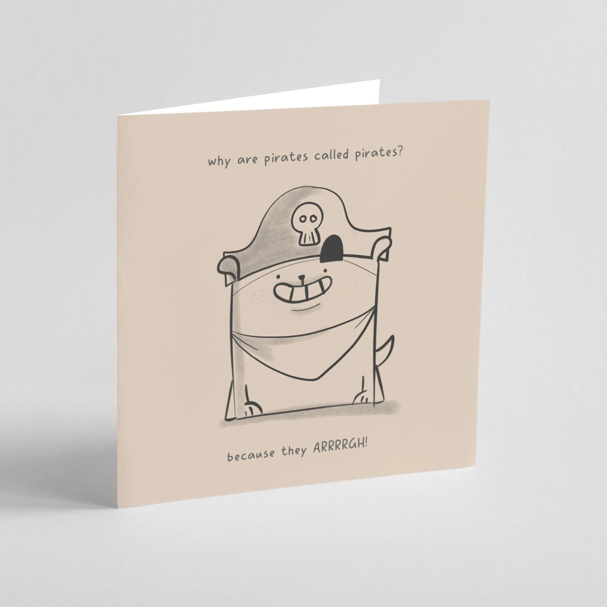 Card with a cartoon dog in a pirate costume and humorous text on a beige background