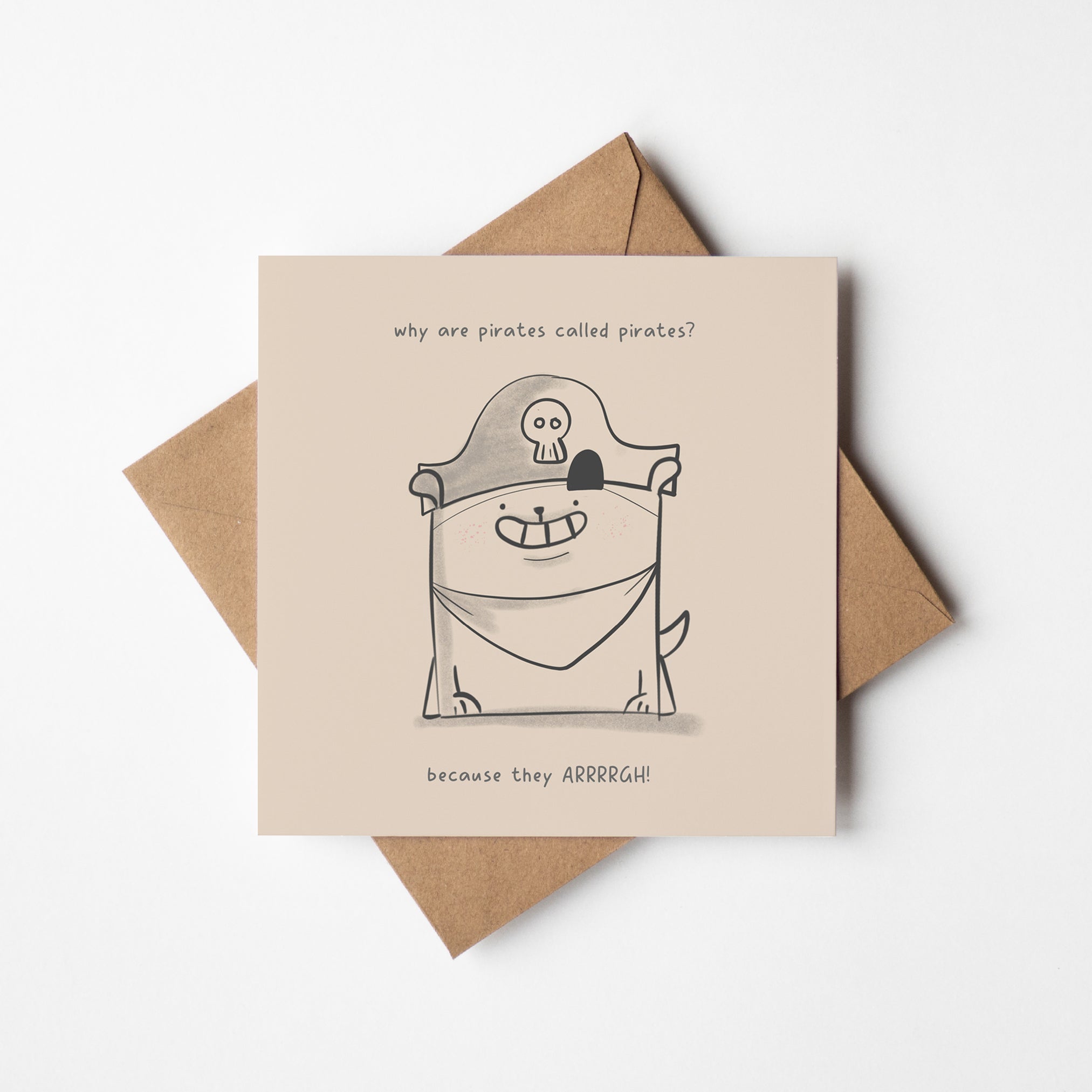 unny pirate joke card featuring adorable dog character with skull and crossbones hat and kraft envelope