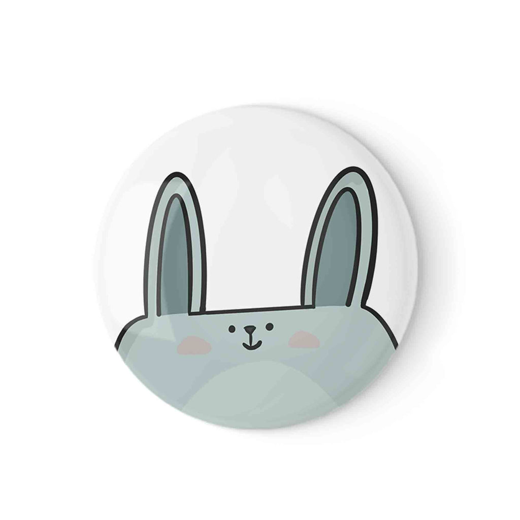 Round badge pin featuring an adorable minimalist design of a bunny's face with a glossy finish