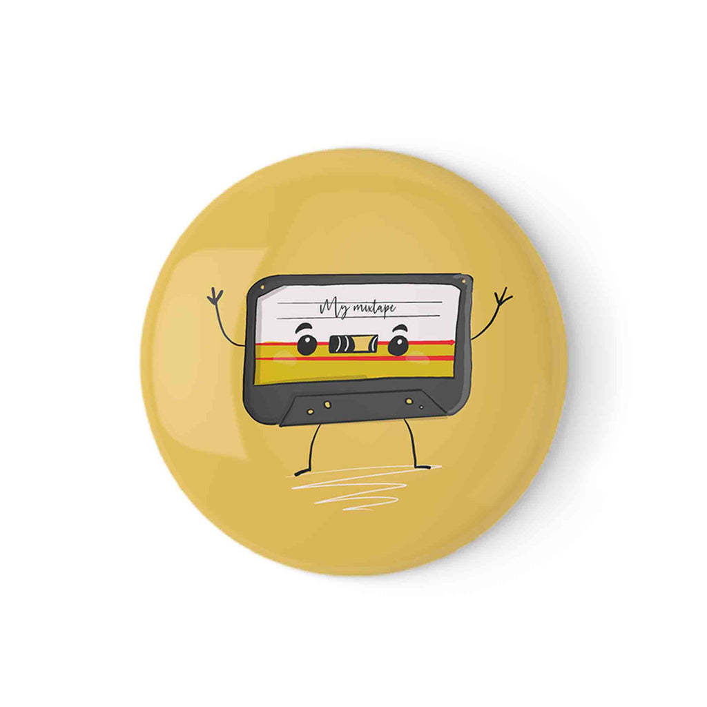 Yellow badge pin featuring a cute illustrated retro cassette tape with a waving hand gesture