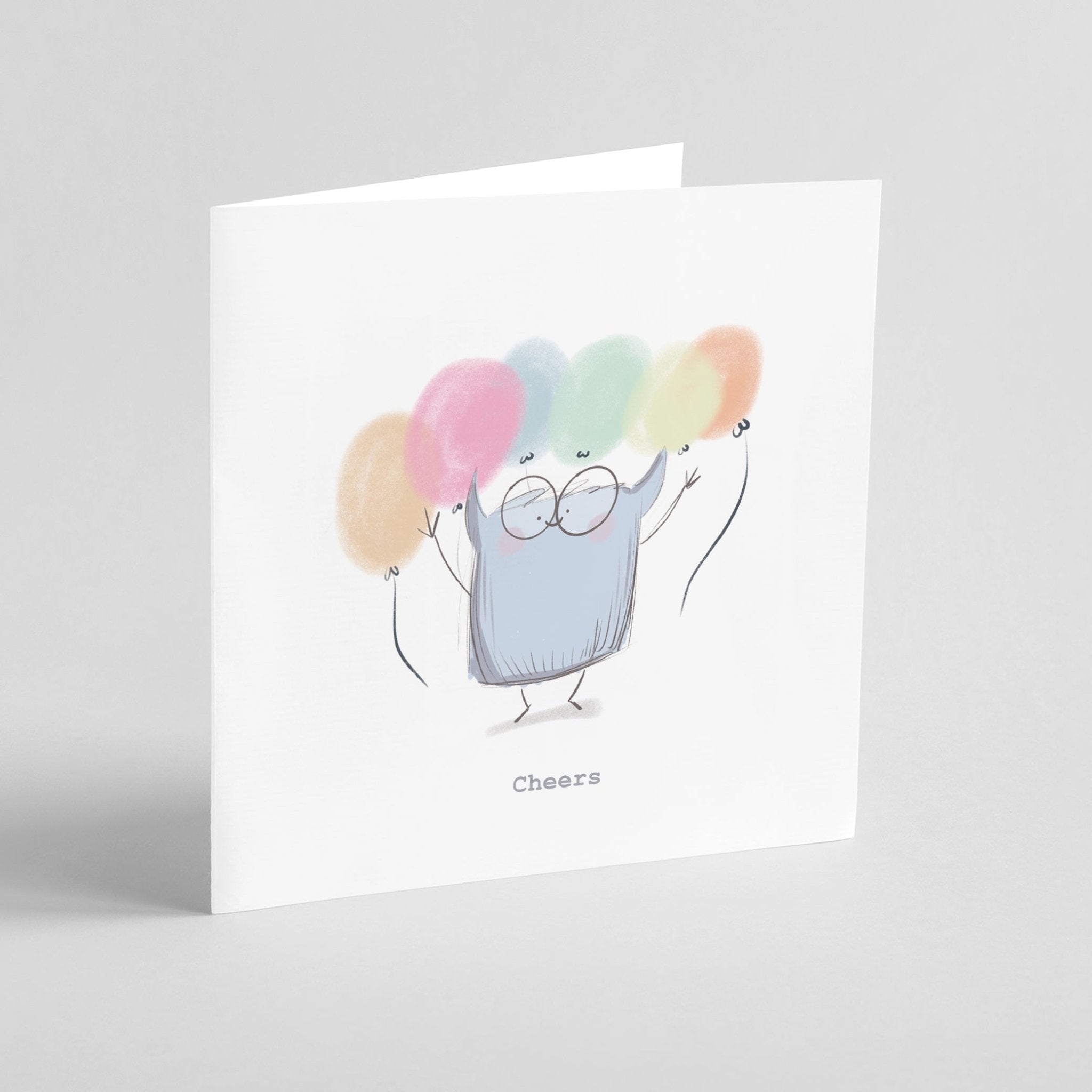 Greeting card with a cartoon character holding colorful balloons and the word 'Cheers'.