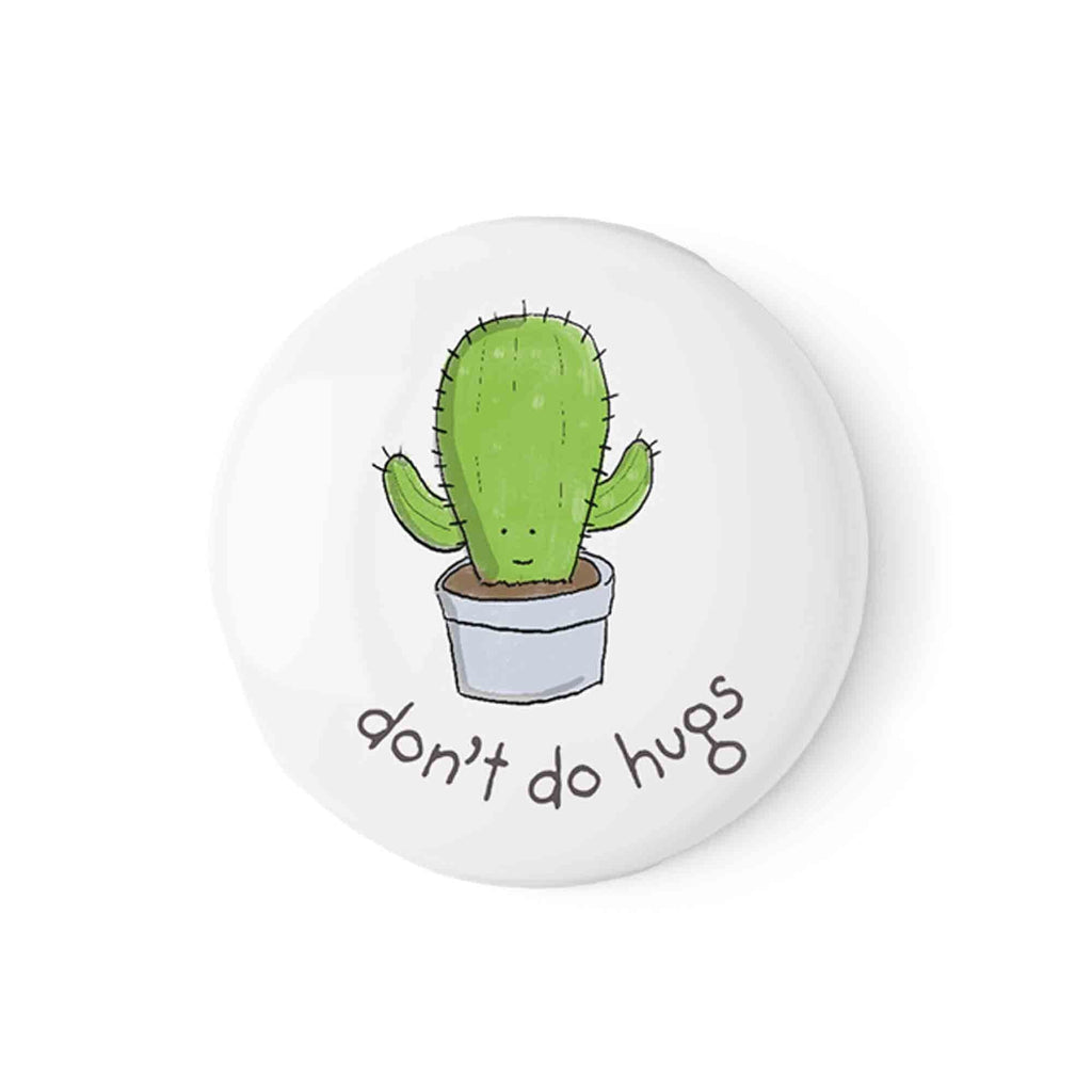Playful 'Don't Do Hugs' cactus illustration on a pin badge by Richard Darani, ideal for personalizing apparel and expressing a fun, personal boundary.