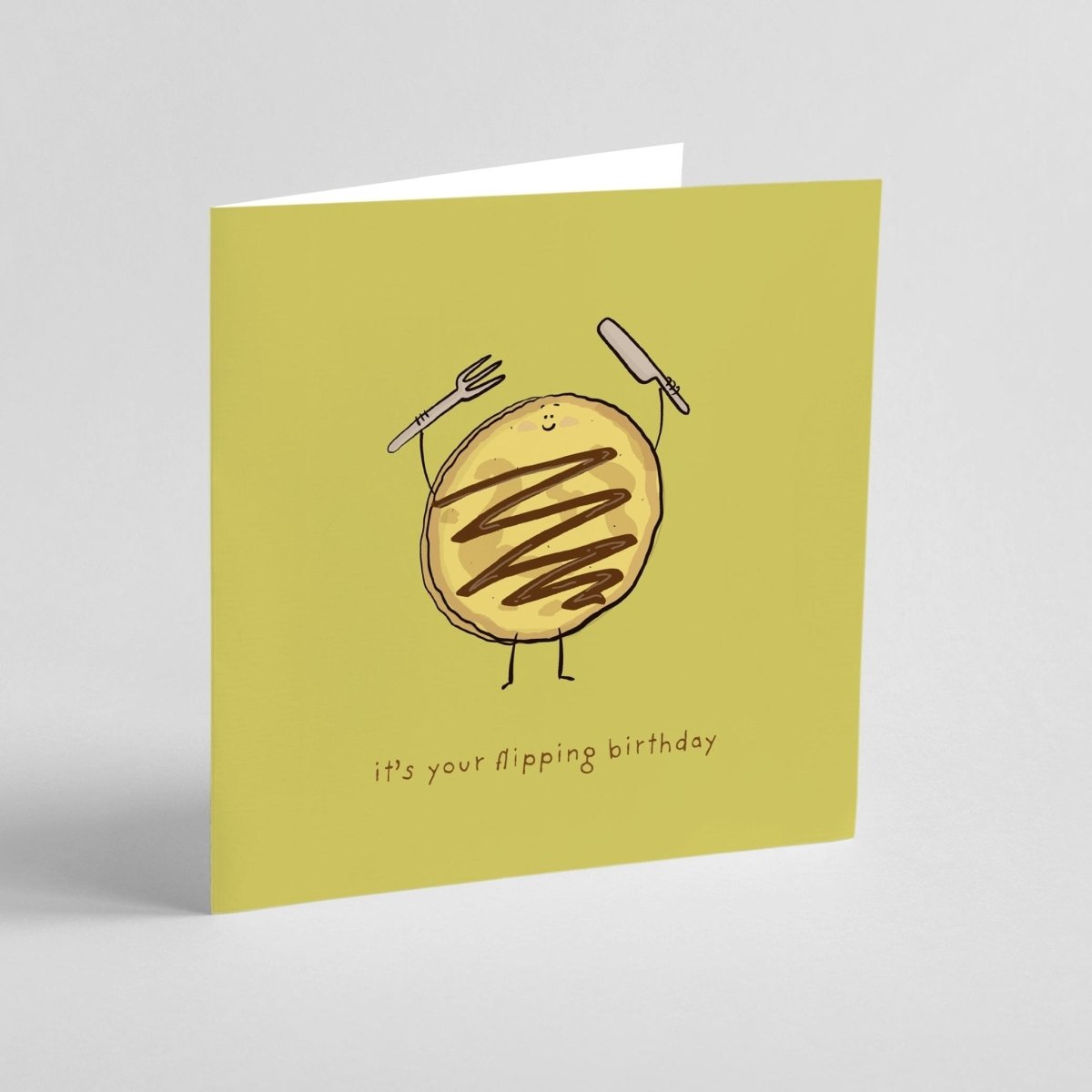 Greeting card with a cartoon pancake illustration and text on a green background