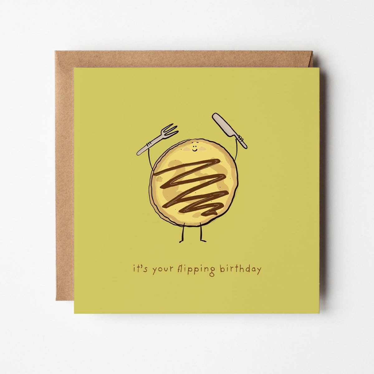 t's Your Flipping Birthday pancake greeting card featuring cheerful pancake character with chocolate drizzle and cutlery