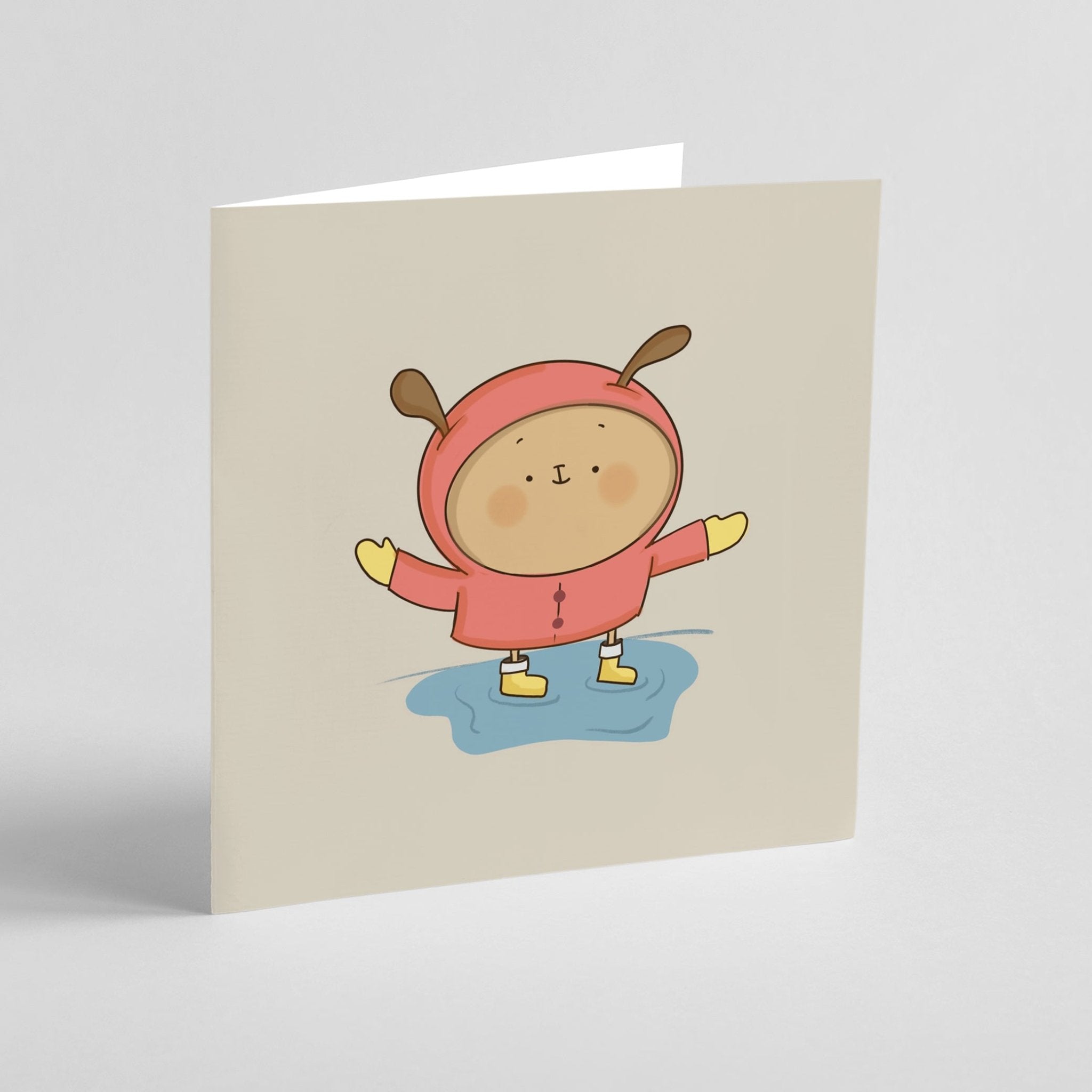 Card with a cartoon character wearing a red raincoat on a beige background