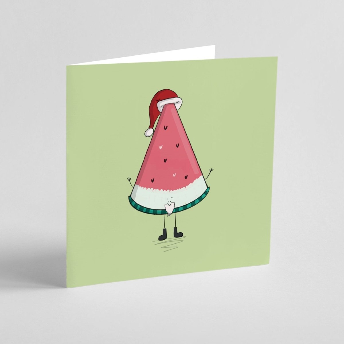 Quirky fruit Christmas card featuring adorable Santa watermelon with festive decorations
