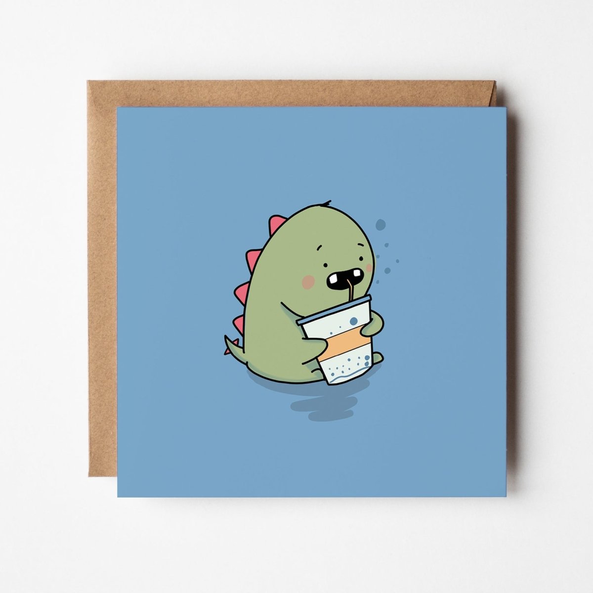 Thirsty Dinosaur greeting card featuring cute green dinosaur sipping soft drink