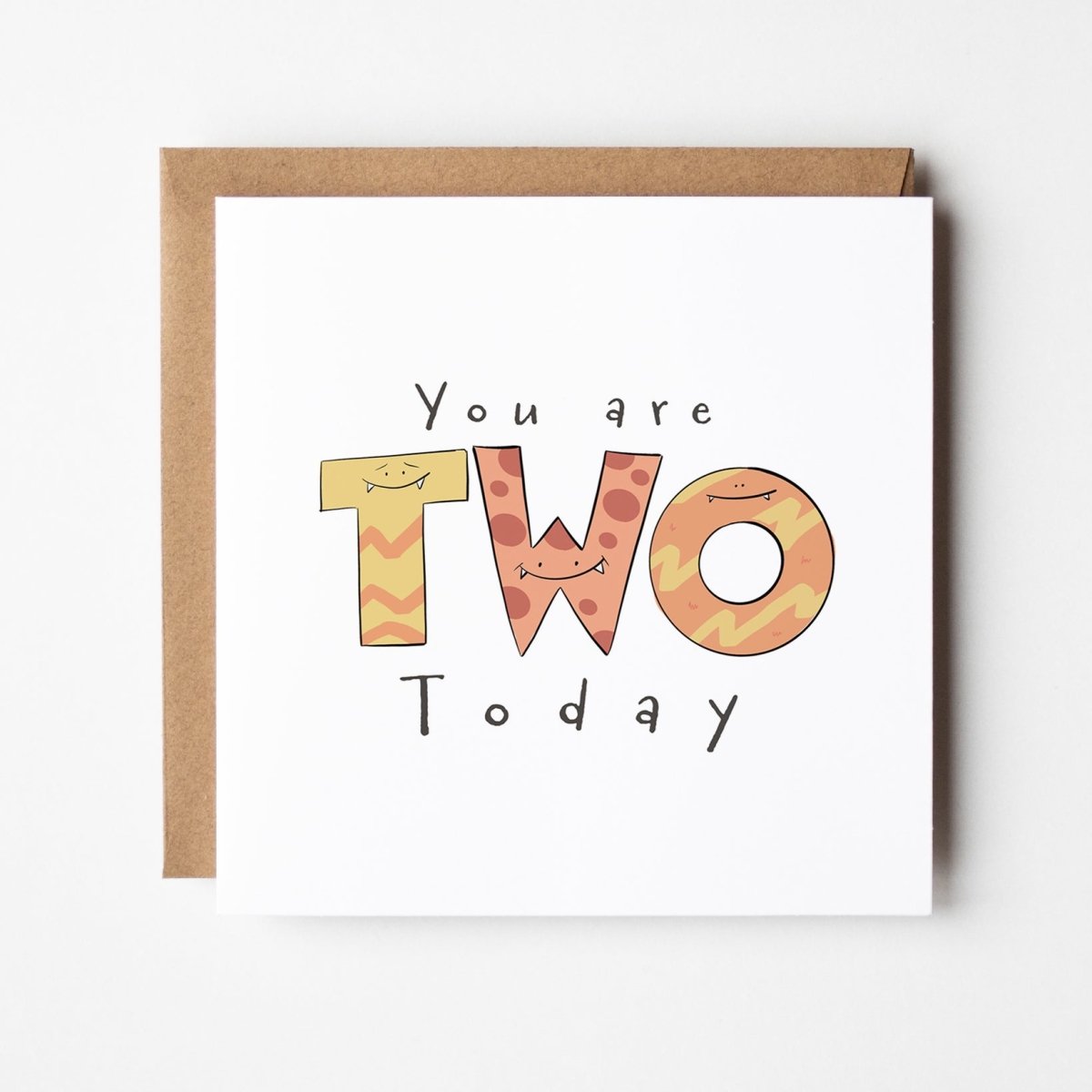 Cute monster milestone birthday card mockup showing TWO spelled with toothy monster characters