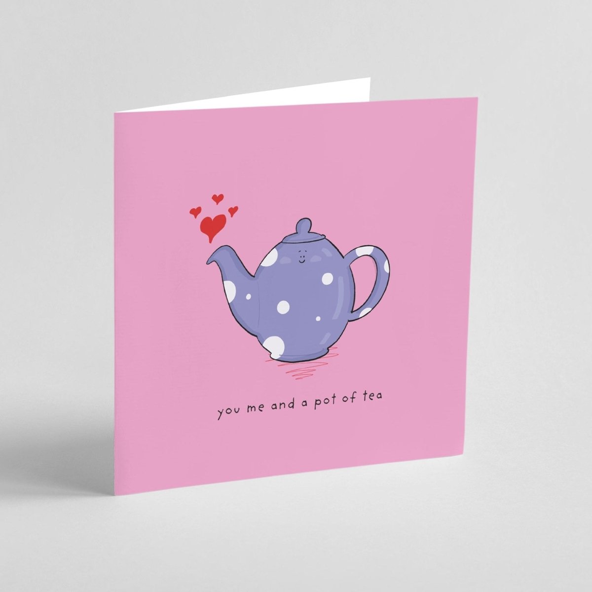 Greeting card with a purple teapot illustration on a pink background