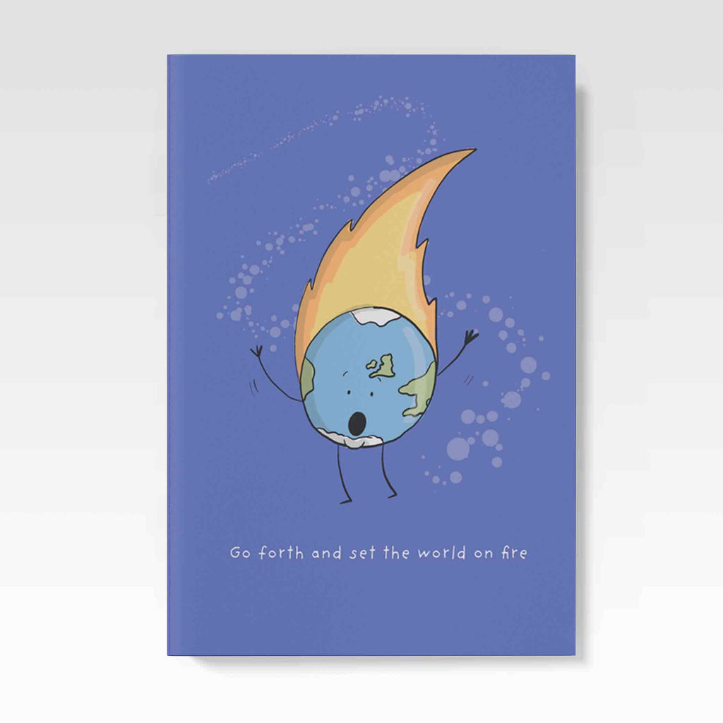 “A hand holding a blue A5 notebook with a playful illustration of the Earth with arms and legs, its top ablaze with orange and yellow flames, and the text ‘Go forth and set the world on fire’ at the bottom.”