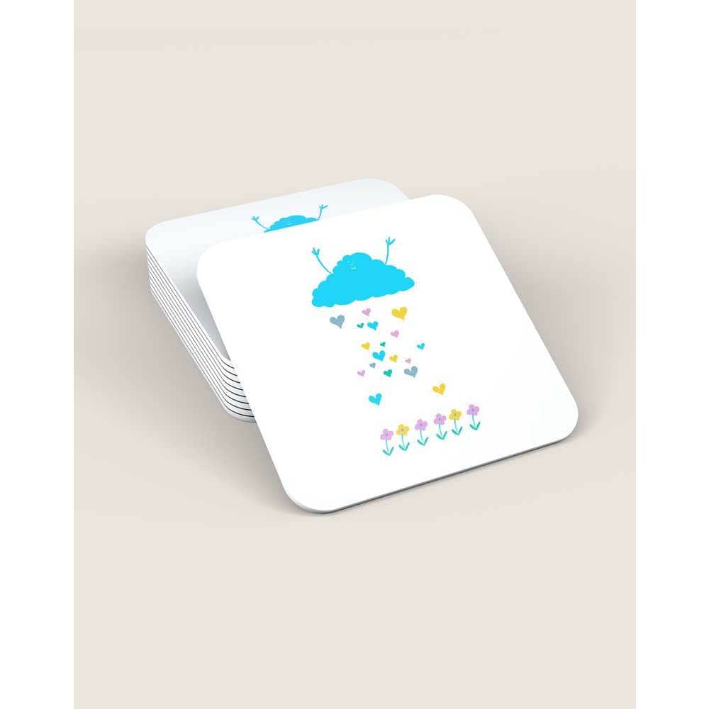 Stack of white square coasters with rounded edges, featuring a cute blue cloud with a smiling face raining multicoloured hearts, on a beige background.

 