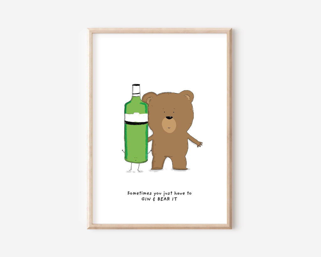 Gin & Bear It' art print with a content brown bear beside a gin bottle, perfect for enhancing the charm of home bars and kitchens.""