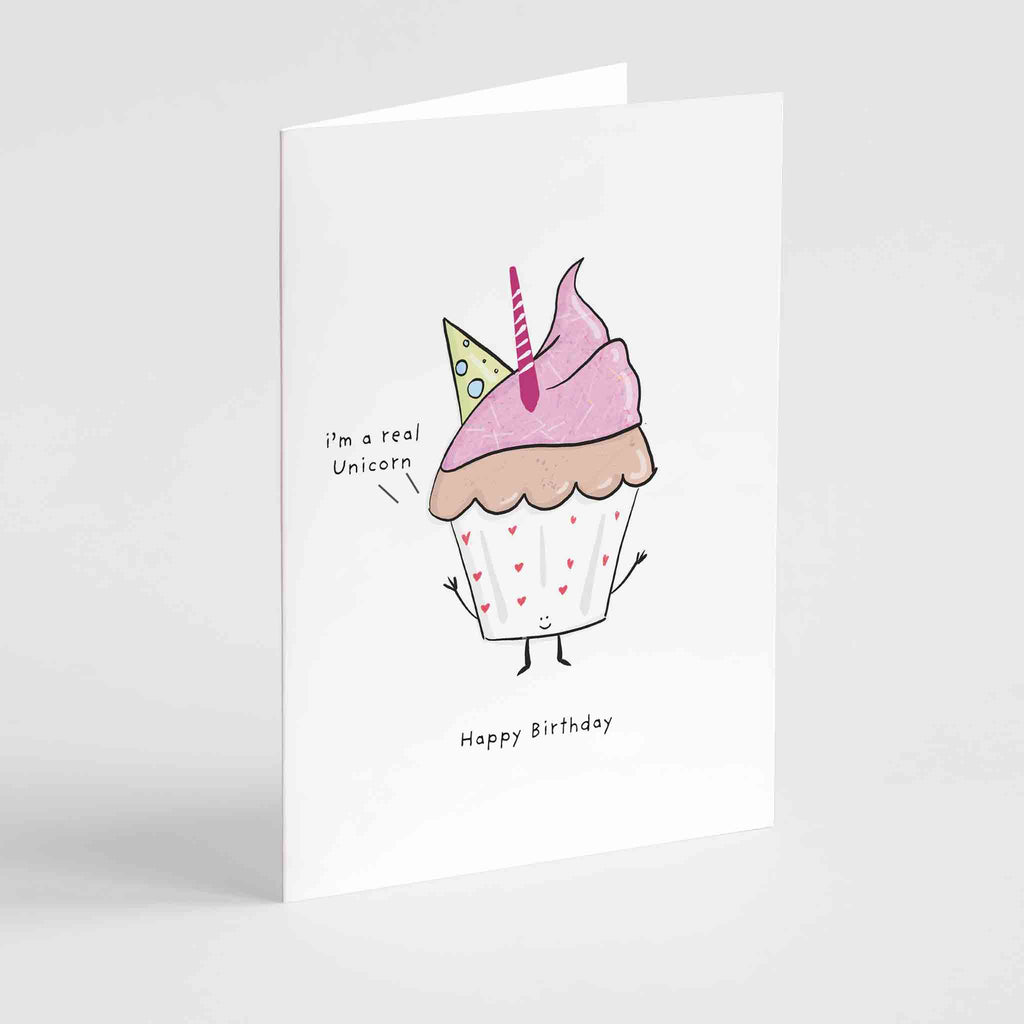 Adorable birthday card featuring a whimsically illustrated cupcake with pink icing, a pink candle, and a hint of unicorn magic, captioned "Happy Birthday" by Richard Darani.