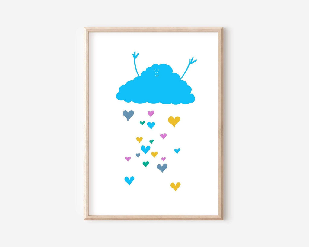 "Art print of a happy blue cloud with colourful hearts raining down, symbolizing joy and love, framed in light wood."