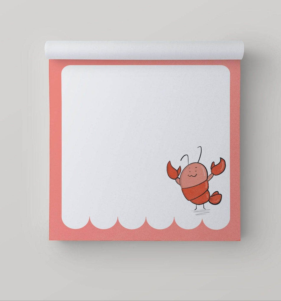 A photo of a square memo pad featuring a lobster illustration on each page, perfect for creative note-taking and doodling.